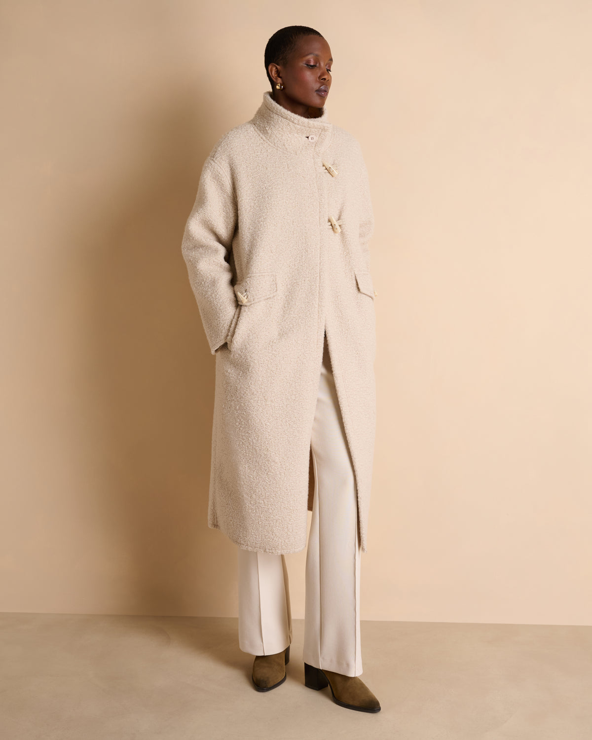Manteau long beige col montant